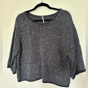 Free People three-quarter sleeve sweater.
